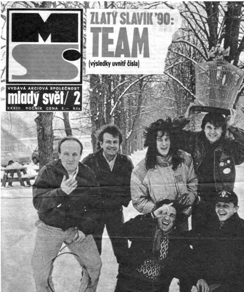 Cover of Mladý Svět magazine. Headline: Zlatý Slavík '90: TEAM (výsledky uvnitř čísla). Photograph of the band outdoors in winter.
